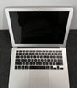 Apple MacBook Air A1466 13.3-inch open showing keyboard and black screen with silver body in good condition