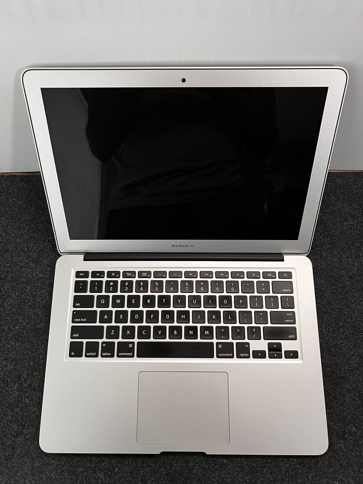 Apple MacBook Air A1466 13.3-inch open showing keyboard and black screen with silver body in good condition