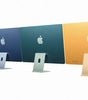 Four Apple iMac 2021 models in purple, blue, green, and yellow colors shown from the back on white background