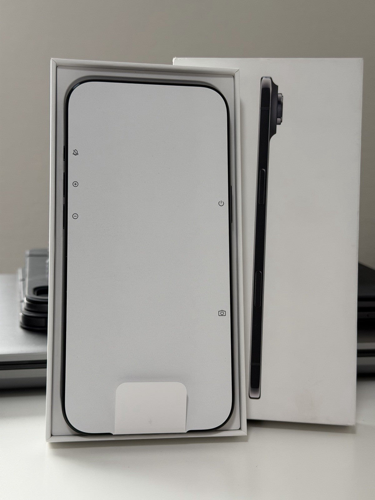 Apple iPhone 17 Air 256GB Black open box showing front screen protective covering and side camera bump in packaging