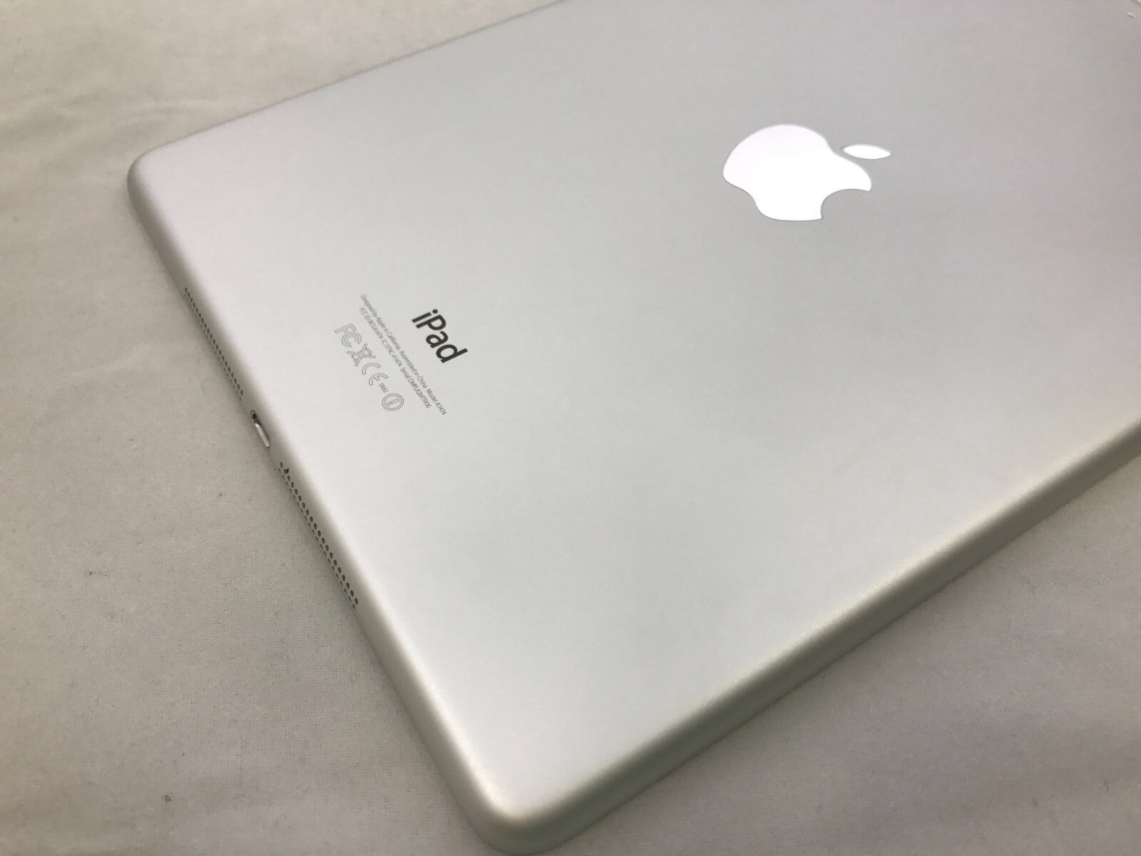 Silver Apple iPad Air 1st Generation 16GB WiFi showing back with Apple logo and clean surface in excellent condition