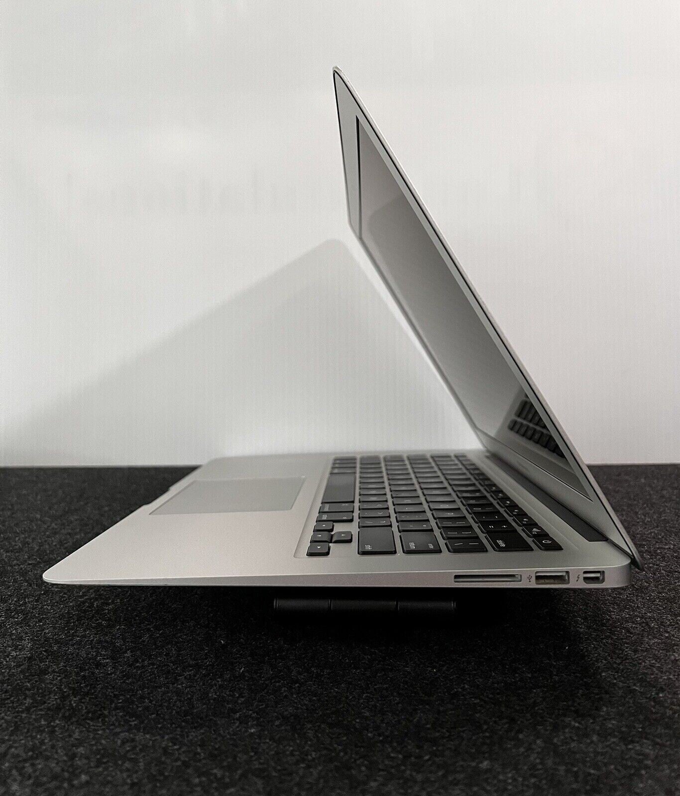 Side view of Apple MacBook Air A1466 13.3-inch Intel i5 laptop with silver finish and partially open display