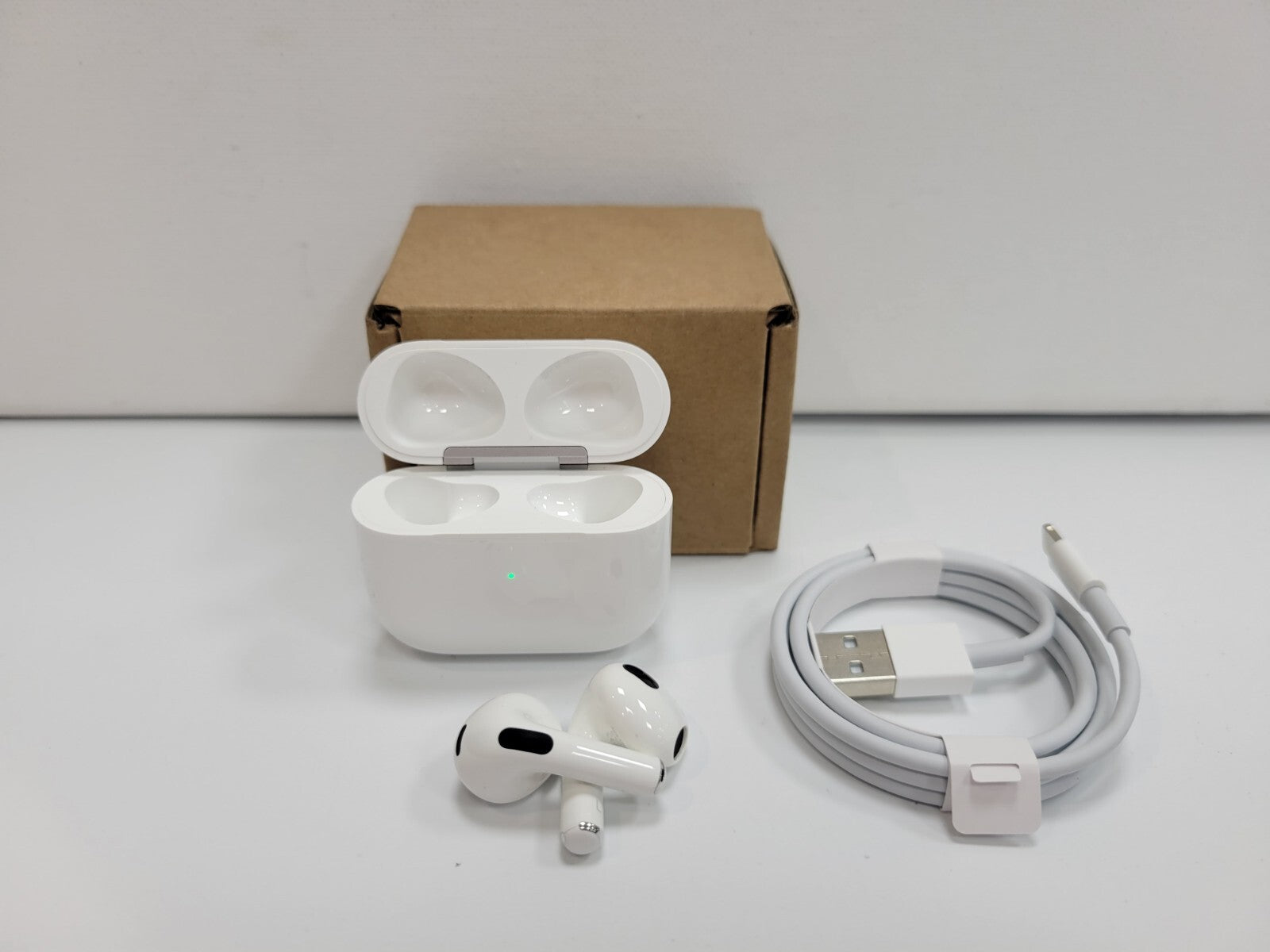 Apple AirPods 3rd generation wireless white in-ear earbuds with charging case, USB-C to Lightning cable, and packaging box