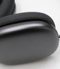 Apple AirPods Max wireless over-ear headset in space gray showing ear cup and headband connection close-up