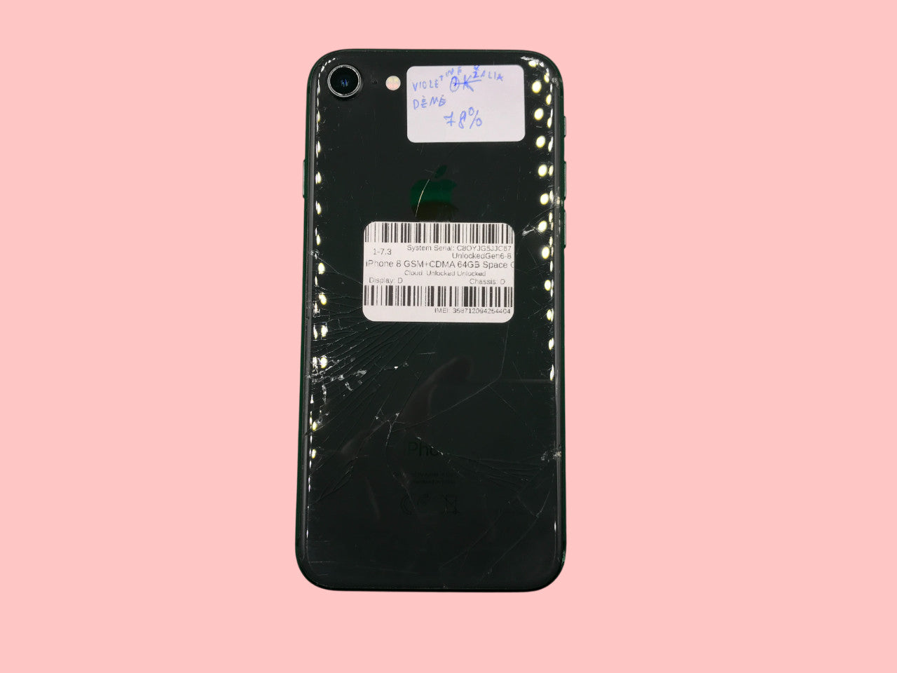 Back view of Apple iPhone 8 A1905 64GB Space Gray with cracked glass and battery health label on pink background
