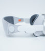 Apple Vision Pro VR headset in gray with solo knit band and light seal, side view on white background