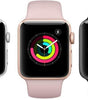 Three Apple Watch Series 3 models in white, rose gold, and black with activity rings and silicone bands displayed front view