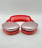 Apple AirPods Max A2096 over-ear headphones in pink with red headband and fabric ear cushions, front view showing charging port