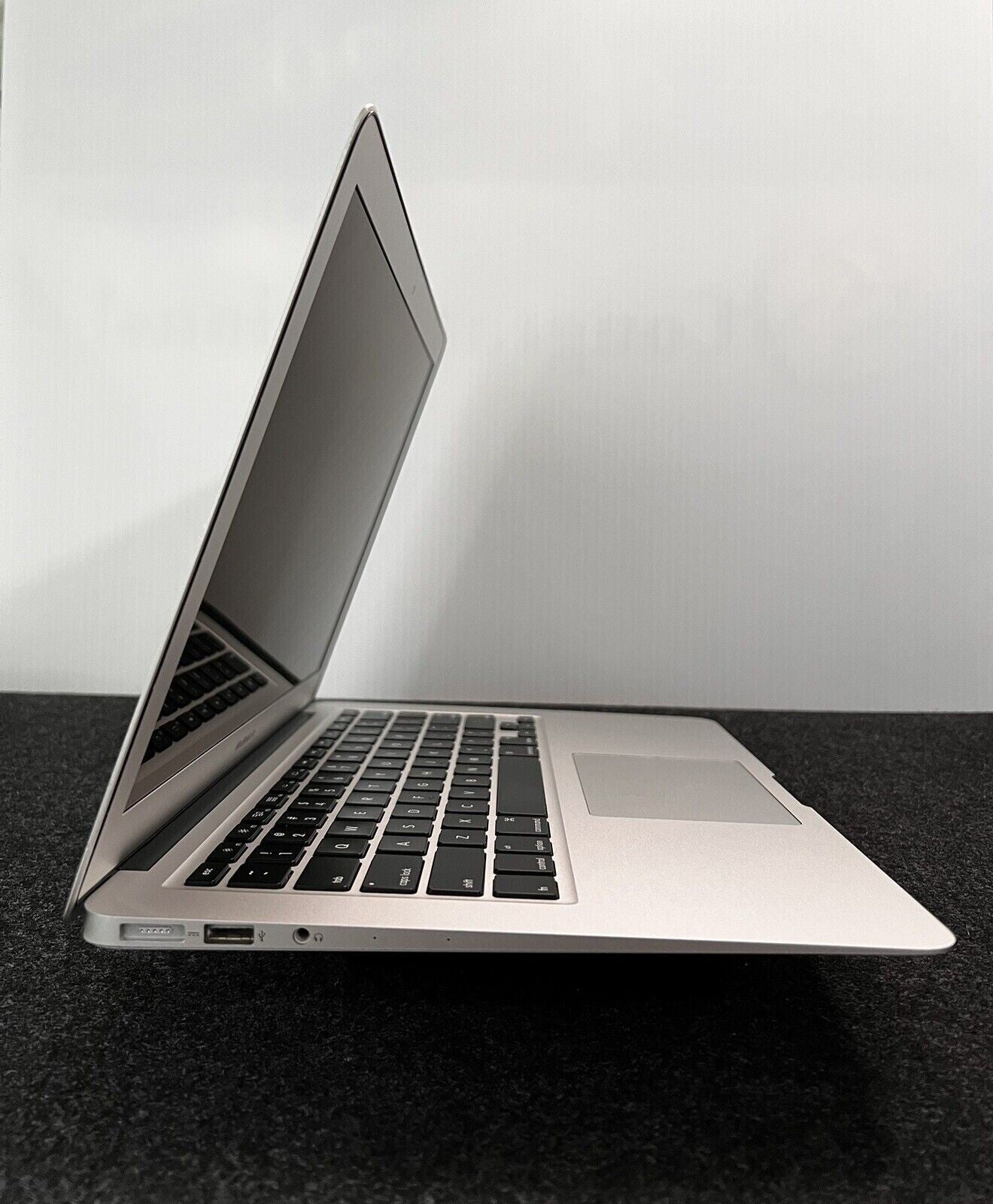 Apple MacBook Air A1466 13.3-inch Intel i5 laptop side view showing keyboard and open screen in silver color