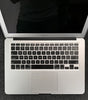 Apple MacBook Air A1466 open top view showing keyboard, trackpad, and part of 13.3-inch screen in silver color