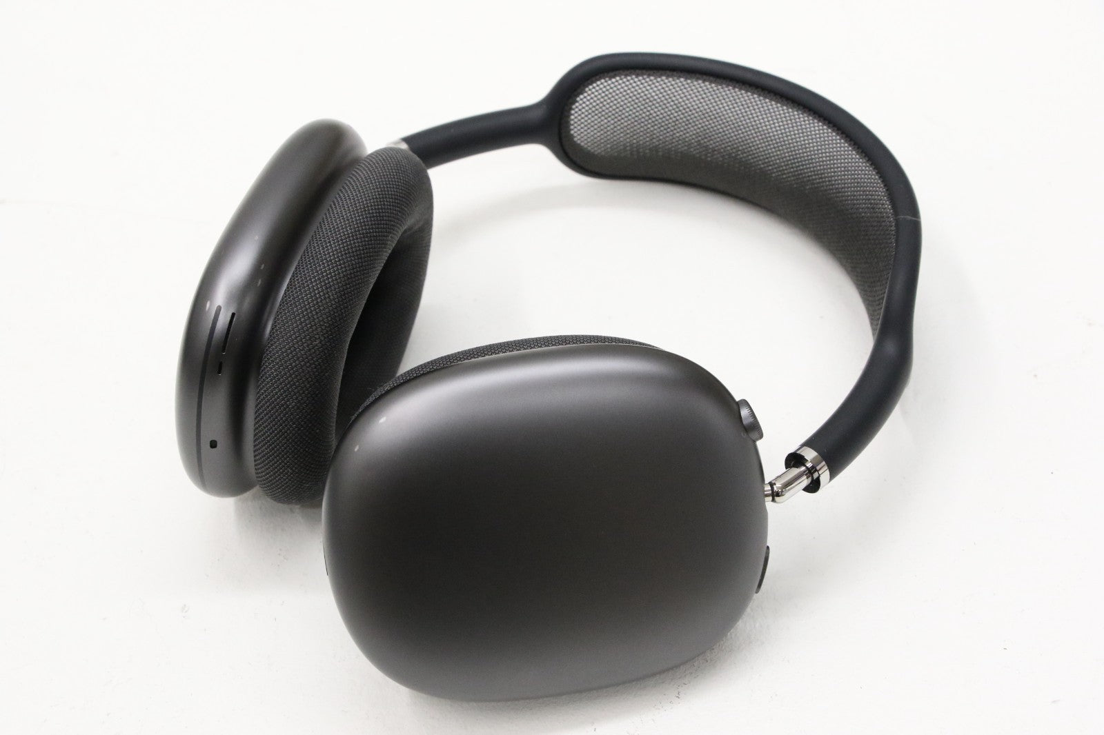 Apple AirPods Max wireless over-ear headset in space gray showing ear cups and mesh headband on white background