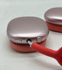 Pink Apple AirPods Max A2096 over-ear headphones close-up showing ear cup with wired connection port and control knob