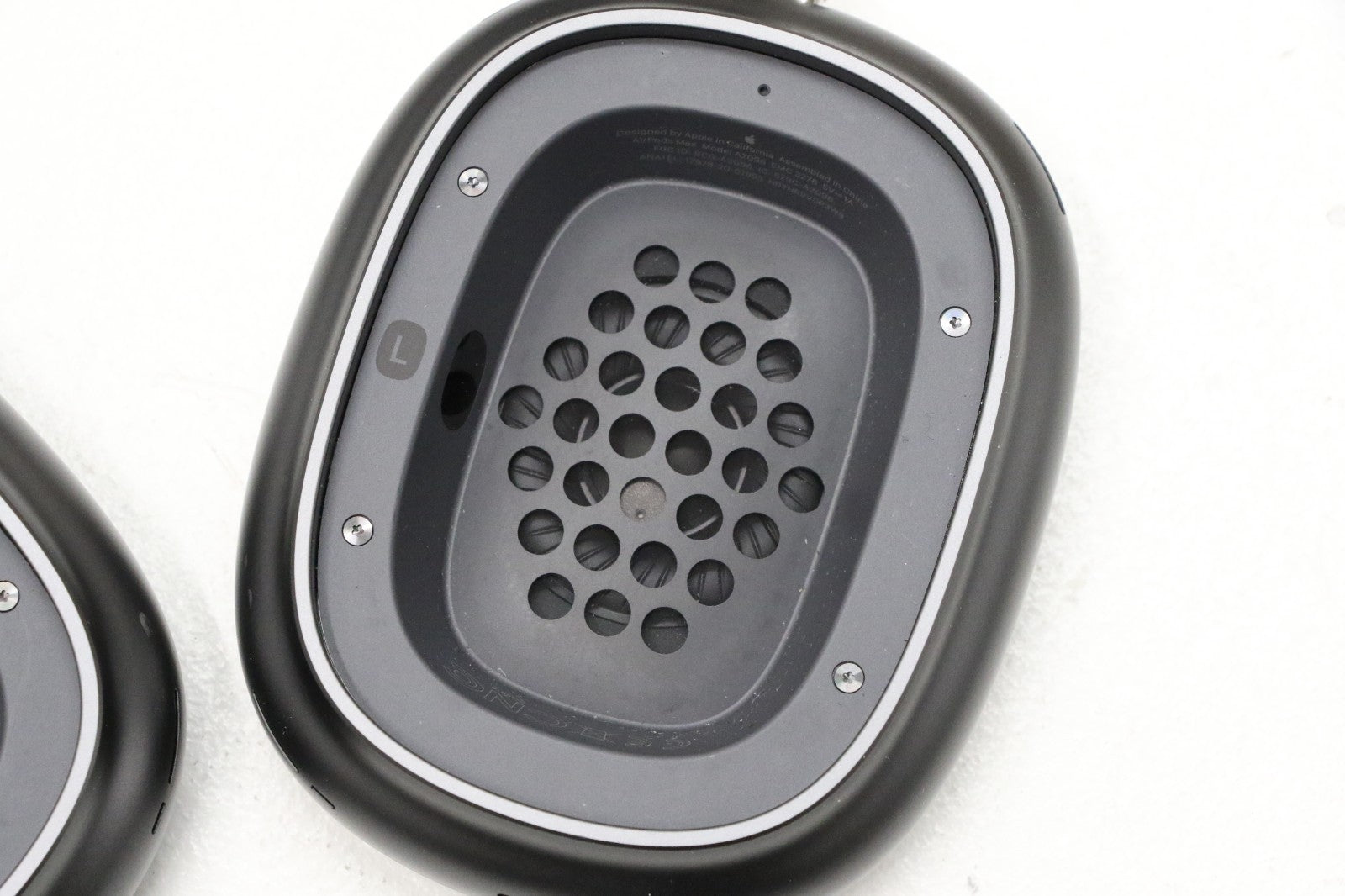 Space Gray Apple AirPods Max ear cup showing speaker grille and inner mesh detailed close-up view