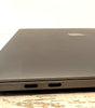 Apple MacBook Pro 15 inch Space Gray closed view showing left side with two Thunderbolt USB-C ports and Apple logo on top
