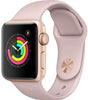Apple Watch Series 3 38mm Rose Gold case with pink silicone band showing activity rings on display