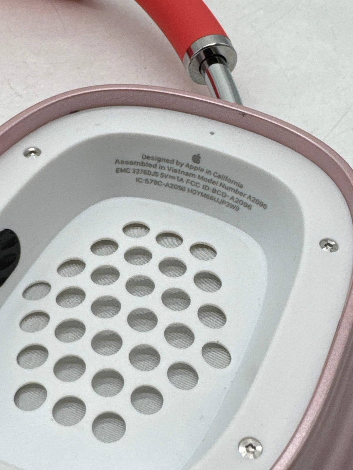 Pink Apple AirPods Max A2096 over-ear headphones showing inner ear cup and mesh detail, wireless Bluetooth model