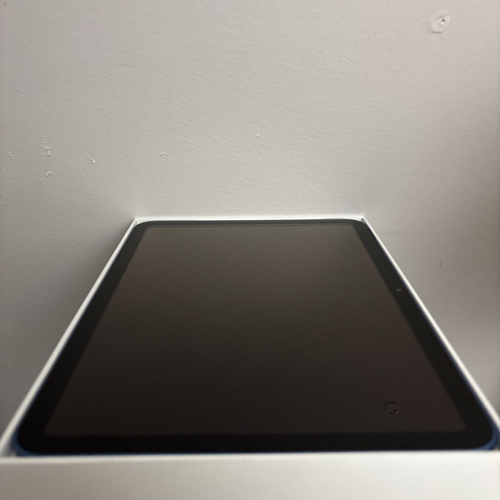 Apple iPad 10th Gen 10.9-inch in blue showing front screen on white box, excellent condition with Wi-Fi and 64GB storage