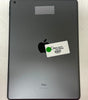 Space Gray Apple iPad 9th Gen 10.2-inch back view showing rear camera and Apple logo with sticker on surface