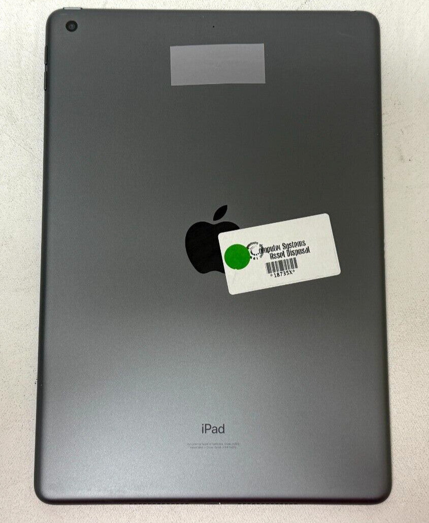 Space Gray Apple iPad 9th Gen 10.2-inch back view showing rear camera and Apple logo with sticker on surface