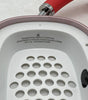 Close-up of Apple AirPods Max Lightning A2096 pink over-ear headphone interior showing speaker grille and text details