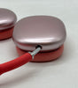 Close-up of Apple AirPods Max A2096 pink ear cup with red headband, showing seamless metal frame and mesh fabric cushion