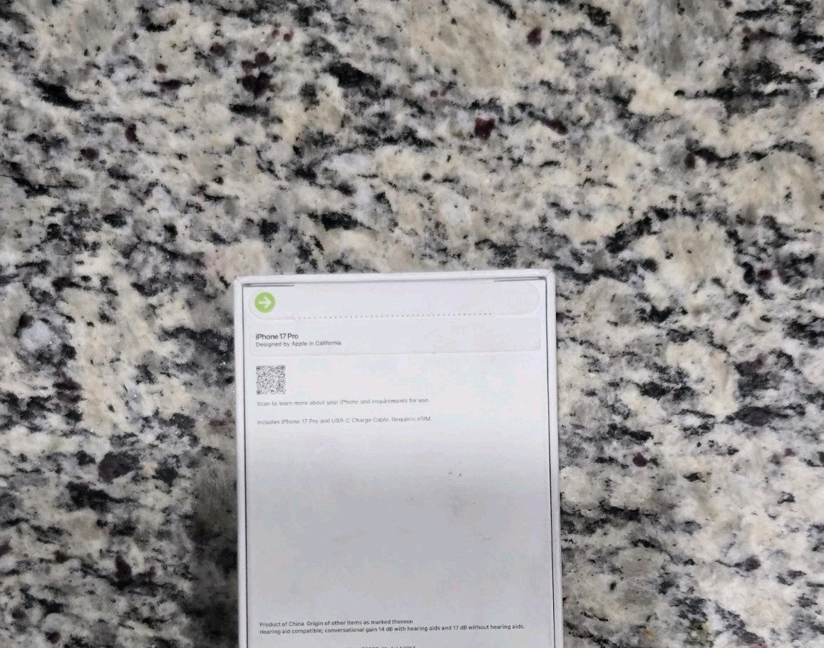 Apple iPhone 17 Pro 256GB box showing back label on granite countertop, T-Mobile Sprint locked model in excellent condition